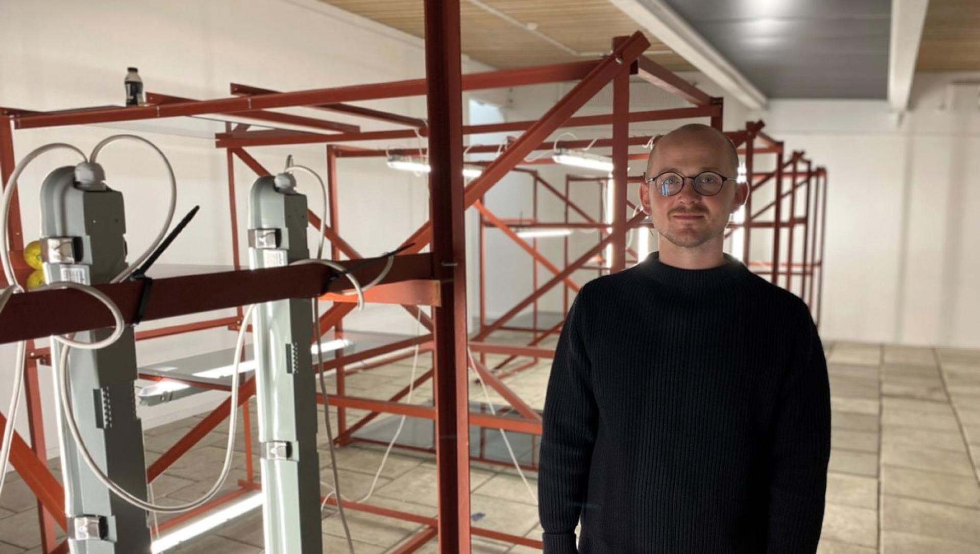 Jóhan Martin Christiansen with his artwork at the National Gallery in the Faroe Islands.