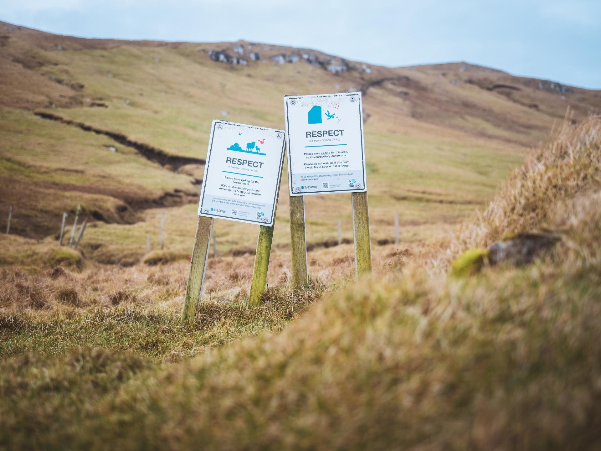 Respect signs are seen in the mountains on a hike to Sandoy in the Faroe Islands. Take by Daniel Villadsen.